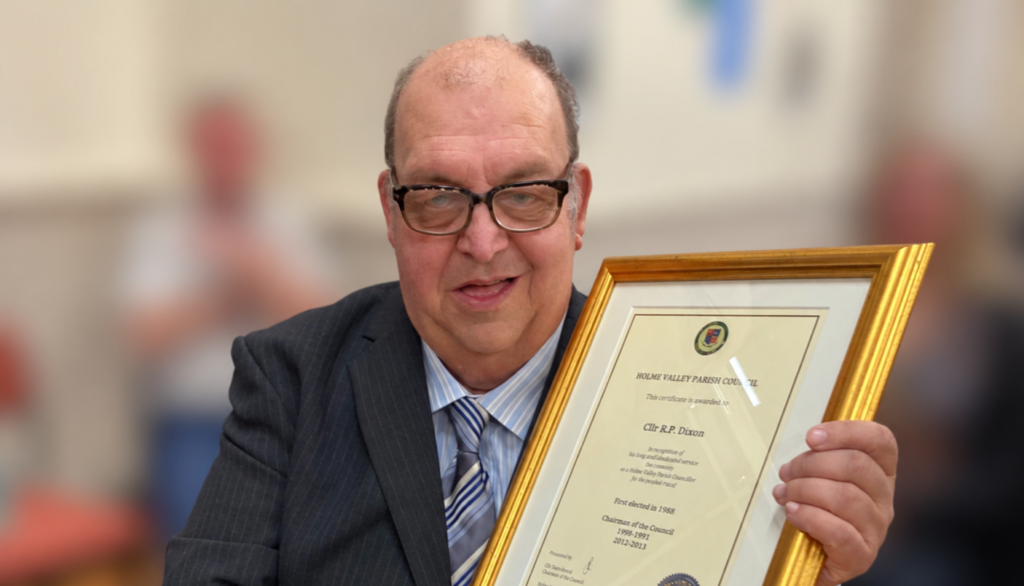Former Cllr Paul Dixon receiving a long service award from Holme Valley Parish Council